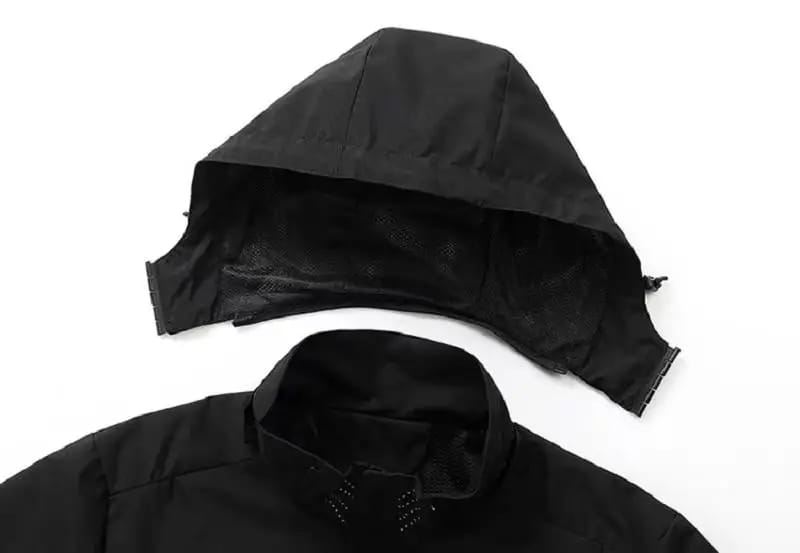 black hooded men waterproof hiking jacket windbreaker with a structured slightly padded design and visible stitching along the seams.