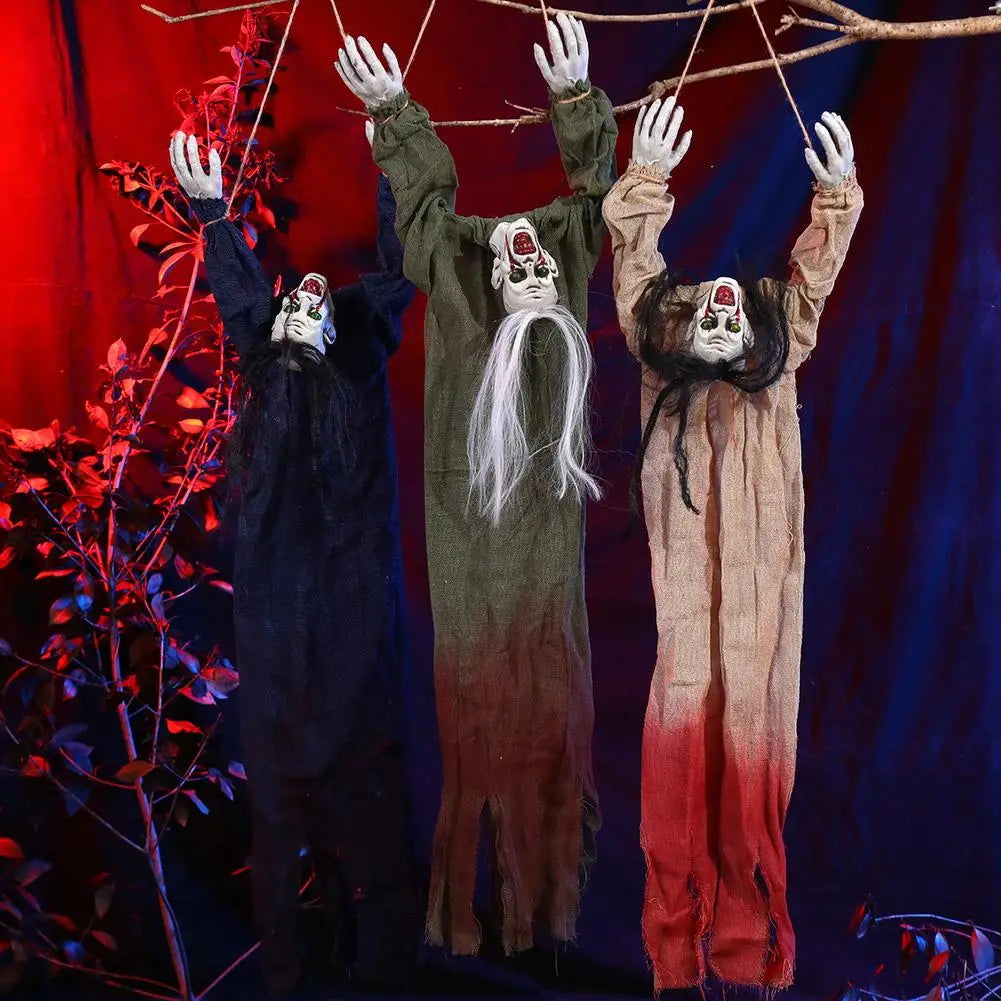 three hanging halloween scarecrow decorations featuring painted faces long hair and tattered fabric costumes in black olive green and beige red gradient for halloween decorations.