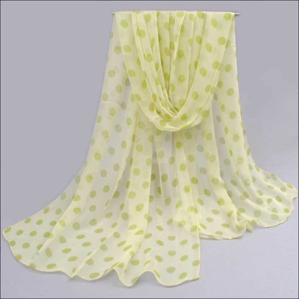 A delicate pale yellow chiffon polka dot silk head wrap scarf with soft green dots.