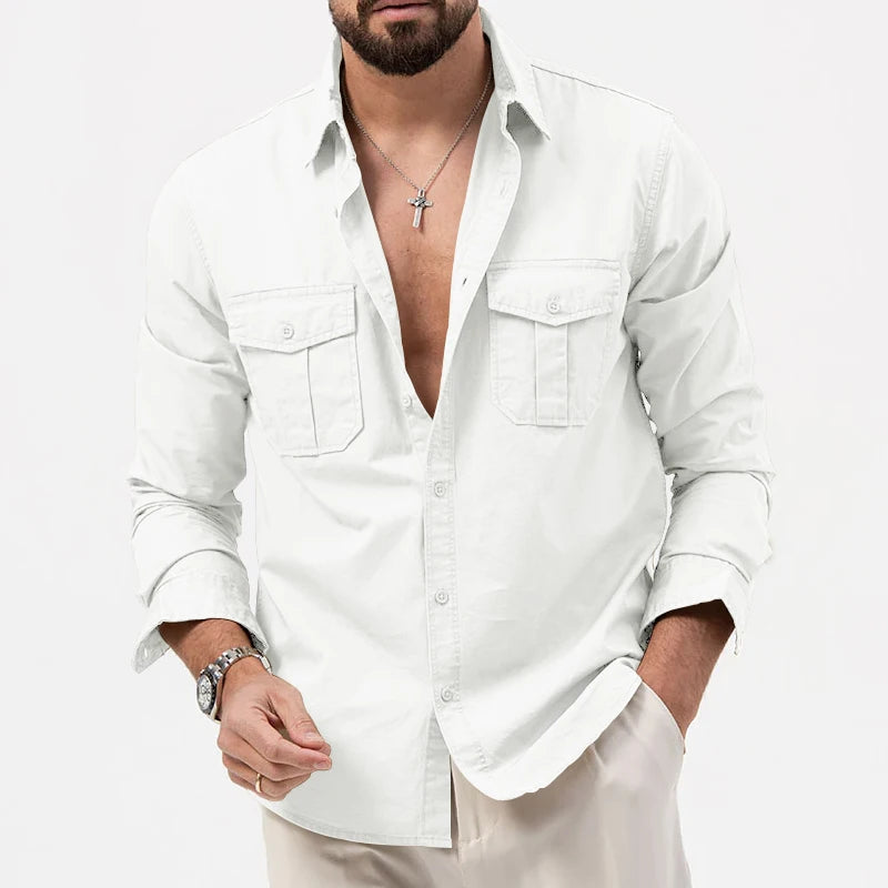 A crisp white men retro long sleeve casual shirt featuring a button-up front, two chest pockets, and rolled cuffs.