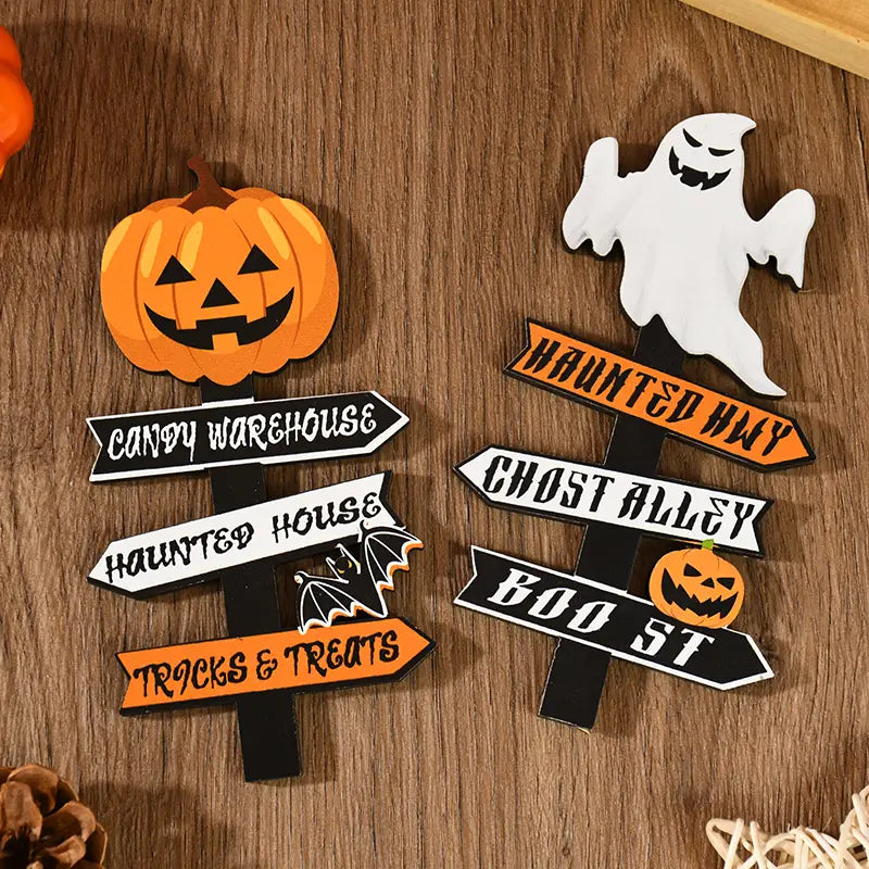 wooden halloween directional sign in orange pumpkin shape with black triangular eyes and mouth featuring a candy warehouse banner for desktop decoration.