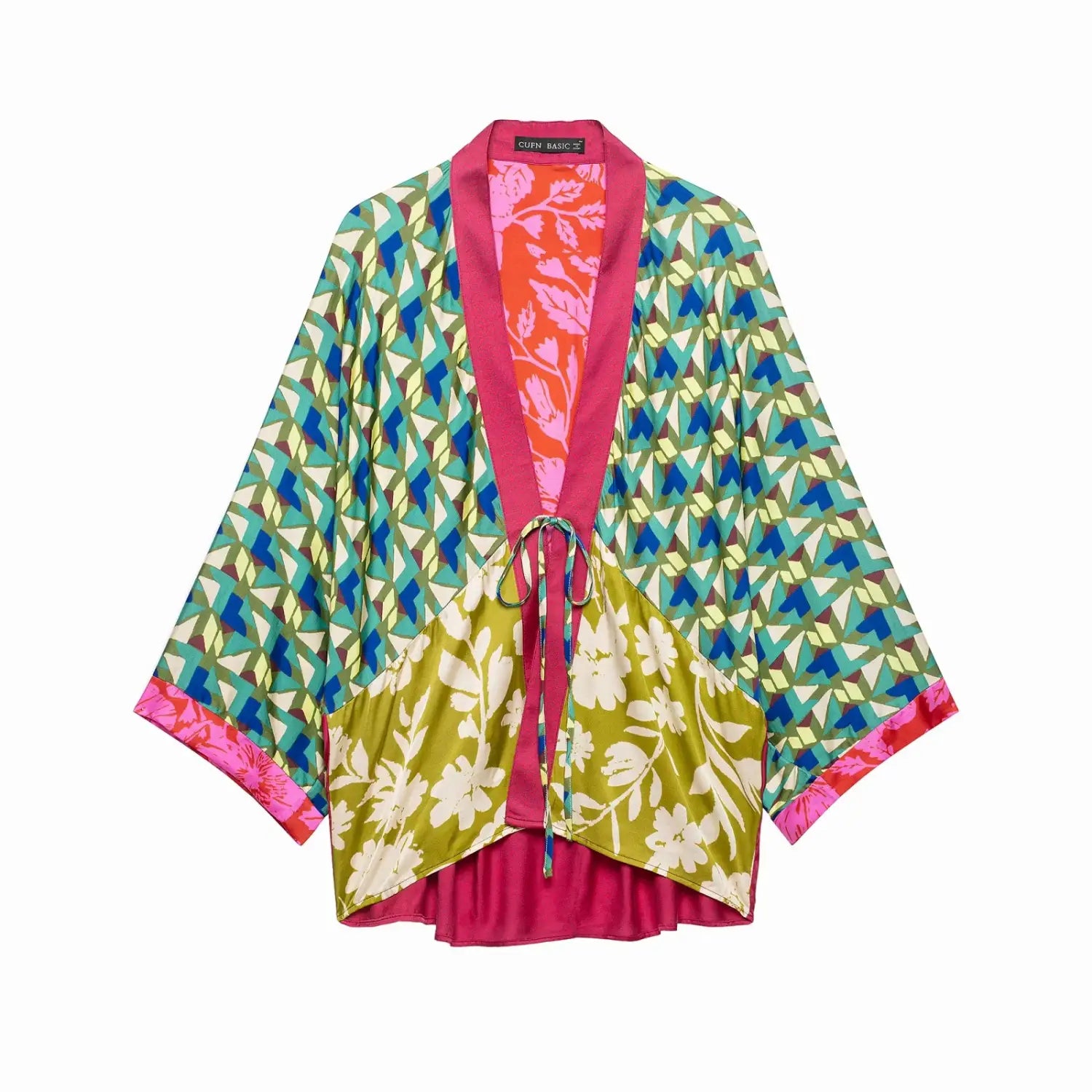 Vibrant floral print two piece midi skirt set featuring a patchwork kimono with geometric and floral patterns in teal lime green pink and orange on silky fabric.