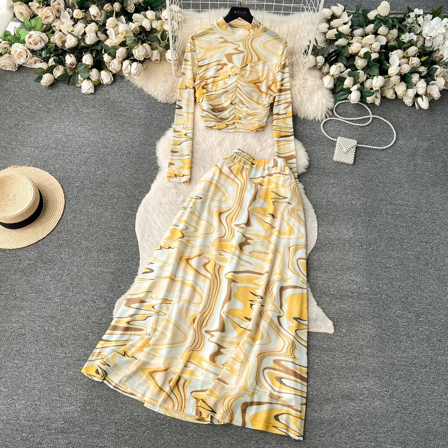yellow and white marbled two piece mesh skirt set with long sleeves high neckline and elastic closure type