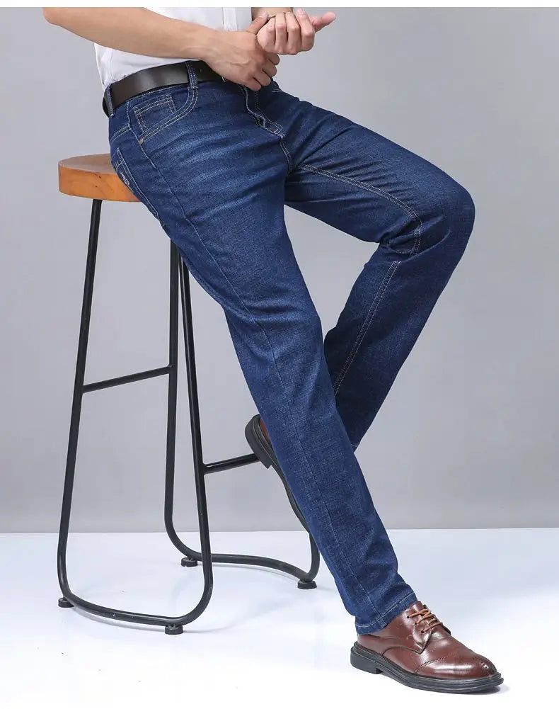 Men’s dark blue stretch cotton jeans with a classic straight-leg cut and visible stitching details for casual wear.