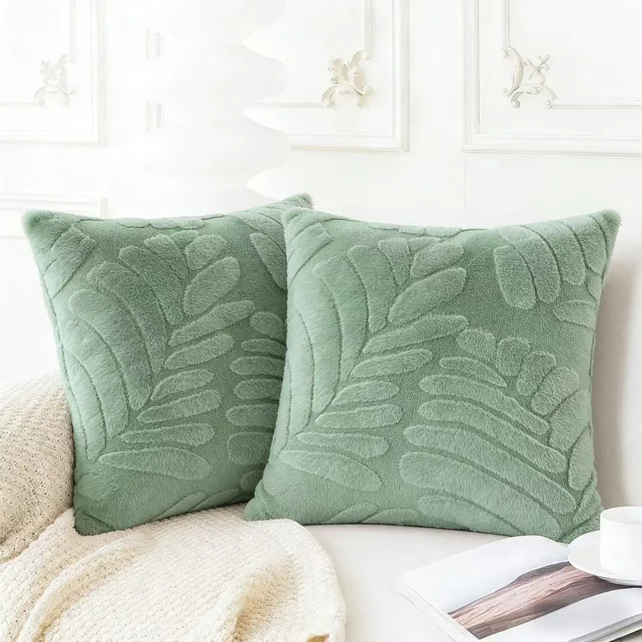 Soft mint green plush throw pillow covers with raised leaf embroidery designed for decorative use.
