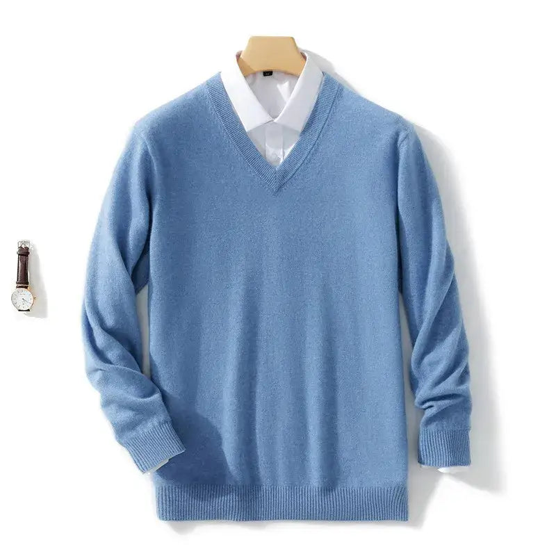 Men cashmere v neck pullover sweater in light blue with ribbed cuffs and hem displayed over a white collared shirt.