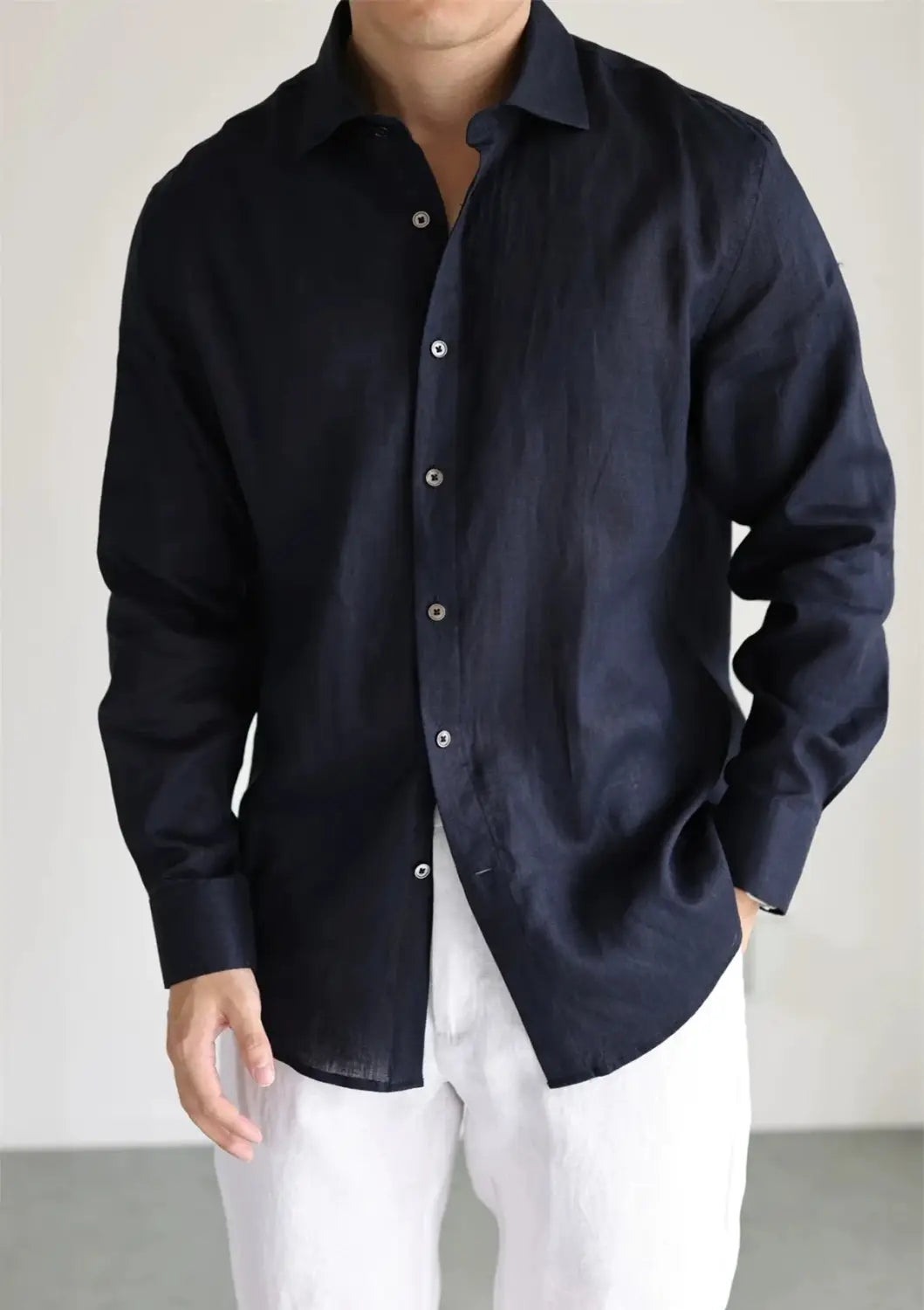 A dark navy men cotton linen casual button down shirt featuring a classic collar and subtle texture.