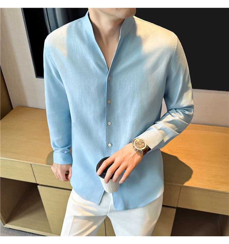 Light blue men’s linen long-sleeved shirt with a mandarin collar and button-up front.