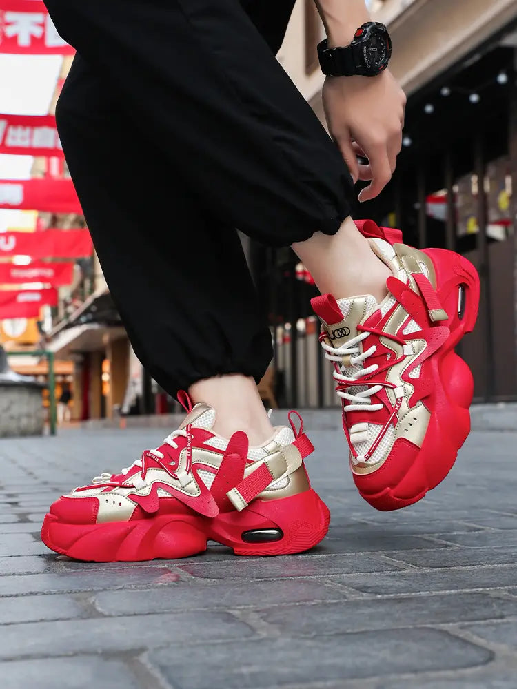 Men chunky air cushion casual sneakers in red and gold with a bold sculpted design and a chunky sole.