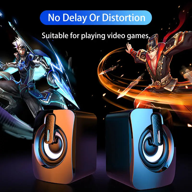 Black and orange usb wired computer speakers with rgb led lights featuring glowing blue led accents for gaming use.