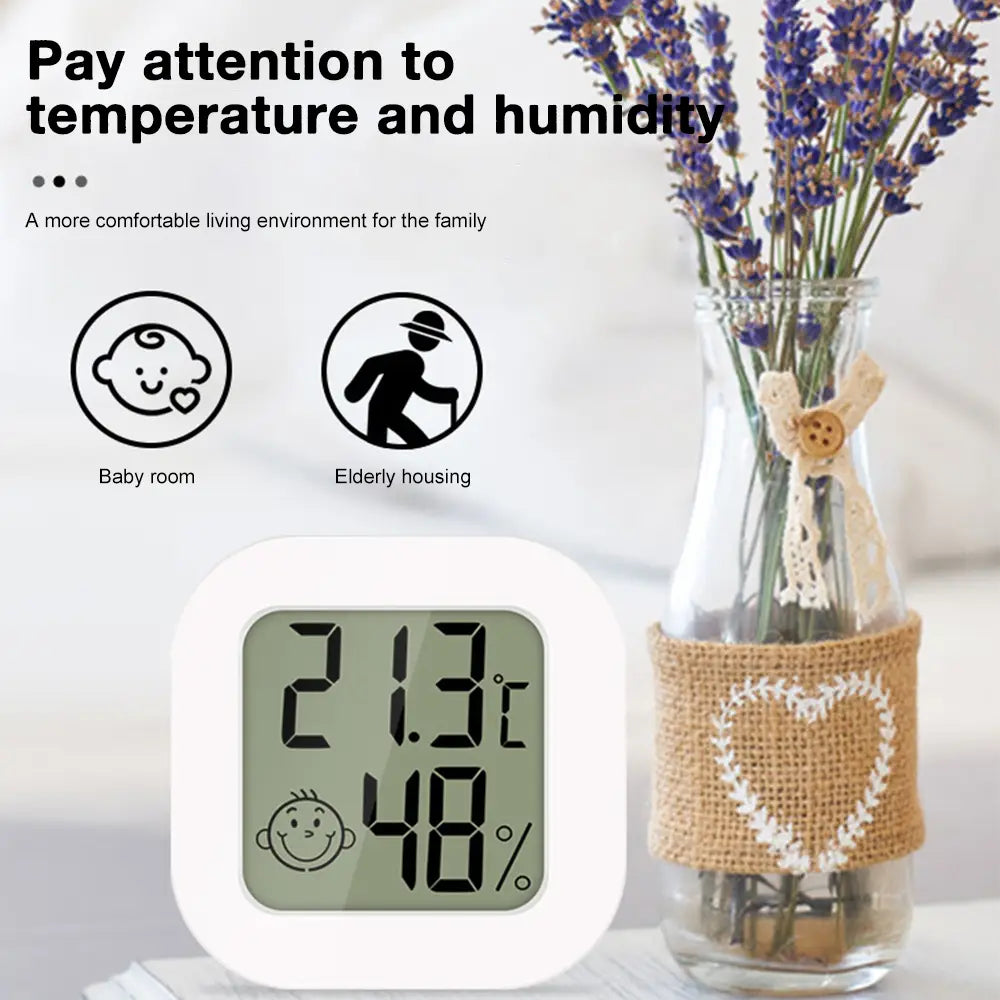White square digital thermometer and hygrometer room sensor displaying 21.3 degrees celsius and 48 percent humidity featuring a clear measurement range for accurate indoor climate monitoring.