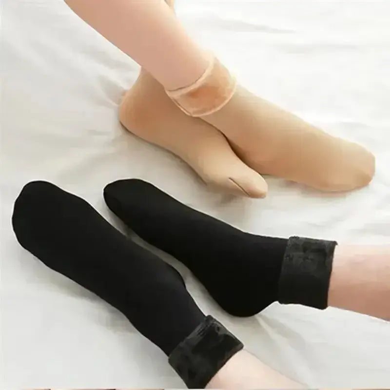 Black ankle-length winter thermal socks with a plush fuzzy cuff made of cashmere wool for warmth and comfort.