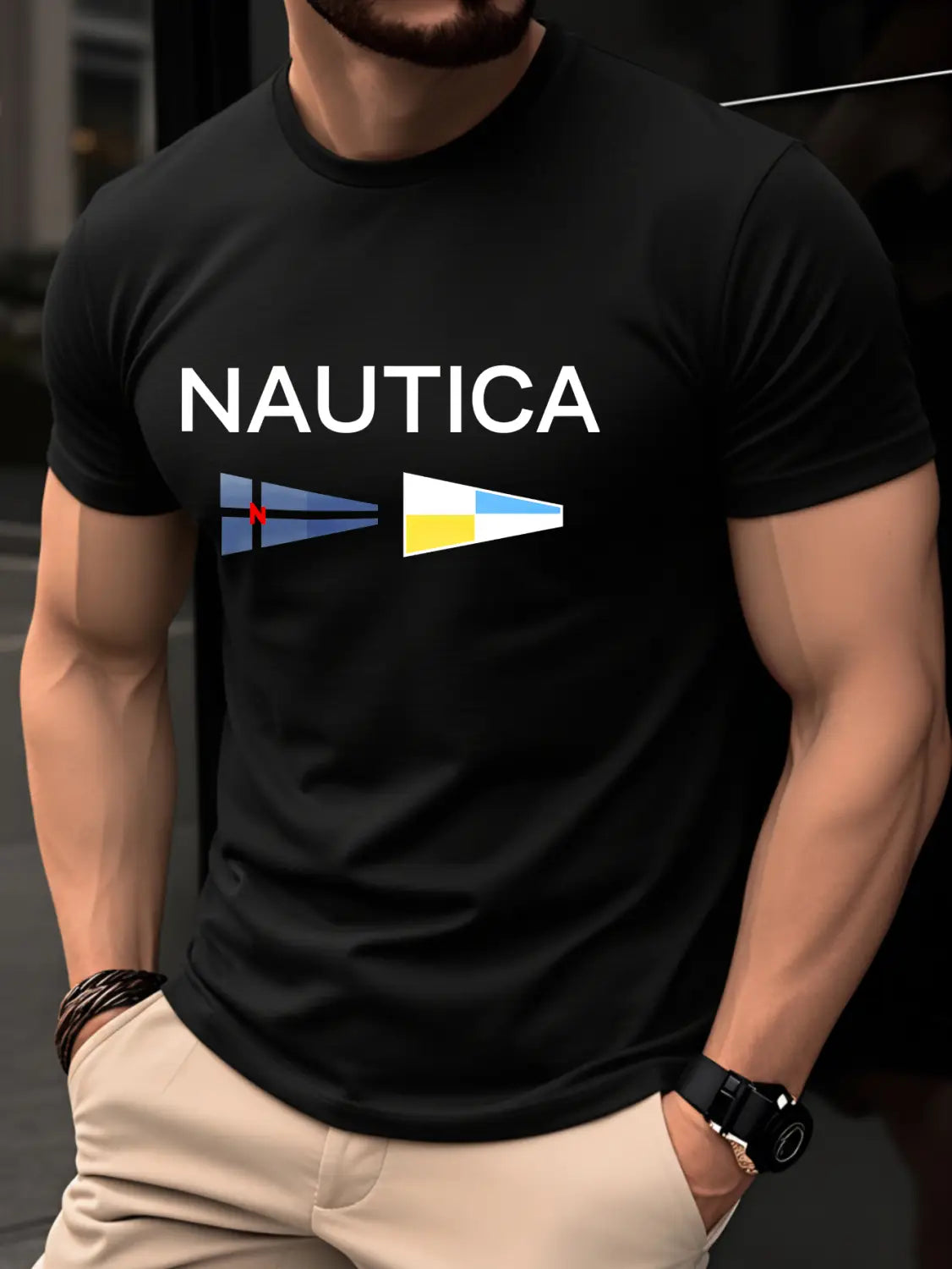 T-shirt d’été pour homme Nautica, imprimé graphique en lettres, noir, en coton, présentant un logo blanc et deux drapeaux de voilier colorés imprimés sur la poitrine.