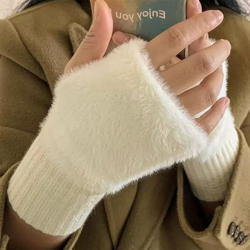 Cream-colored fuzzy knit fingerless gloves with ribbed cuff designed as plush half finger winter gloves for women.