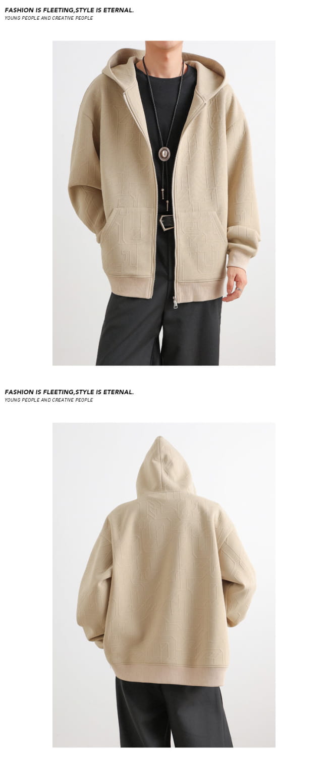 Beige oversized hoodie with front zipper and two side pockets paired with mens black zip up hooded jacket casual urban outerwear.