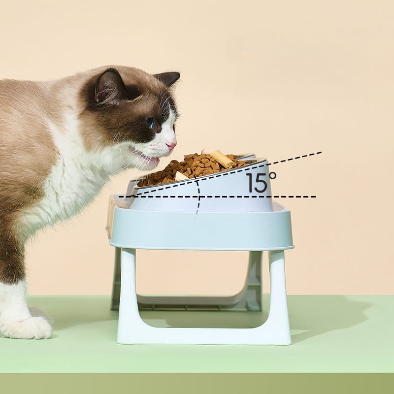 Light blue stainless steel adjustable cat food bowl with 15-degree tilt angle in an elevated pet feeder with tilt bowls.