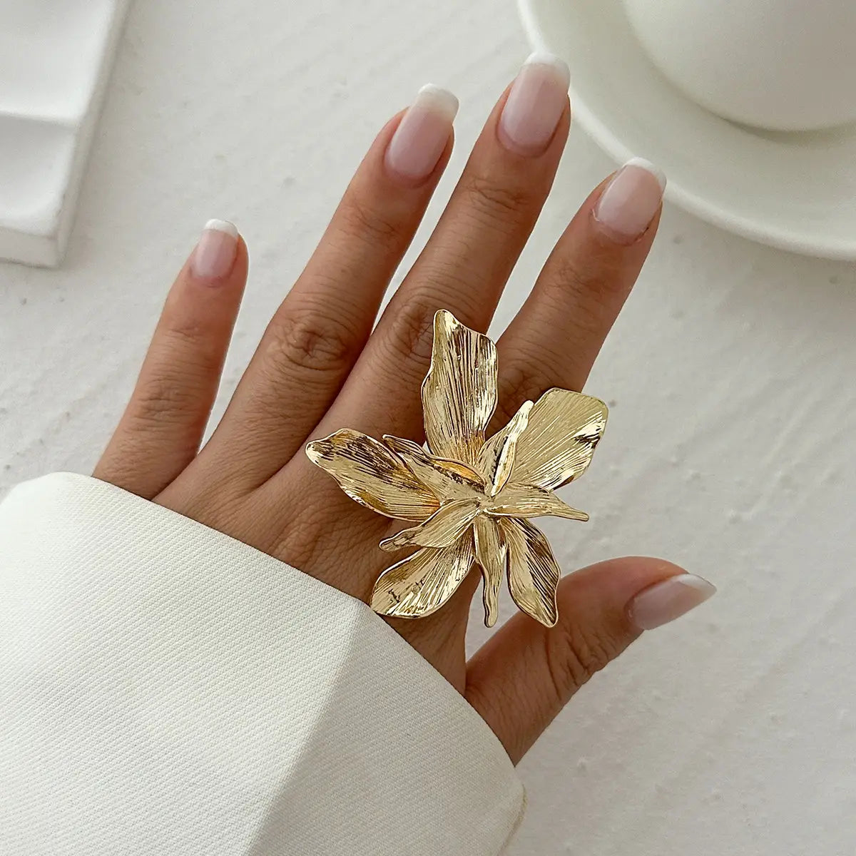Adjustable double layer flower ring in gold color with intricate metallic finish and detailed floral design.
