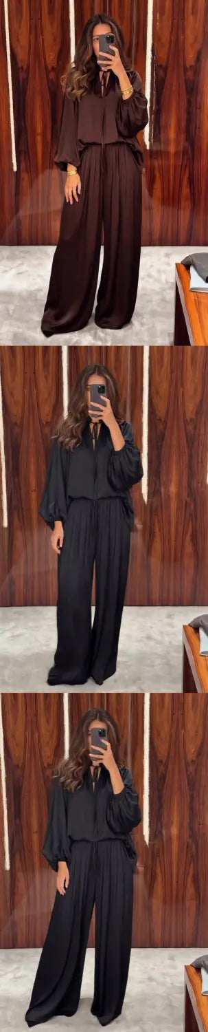 Ein eleganter dunkelbrauner Satin-Zweiteiler-Jumpsuit mit langen Ärmeln und Hosen mit weitem Bein, ausgelegt für die Frühling- und Sommersaison.