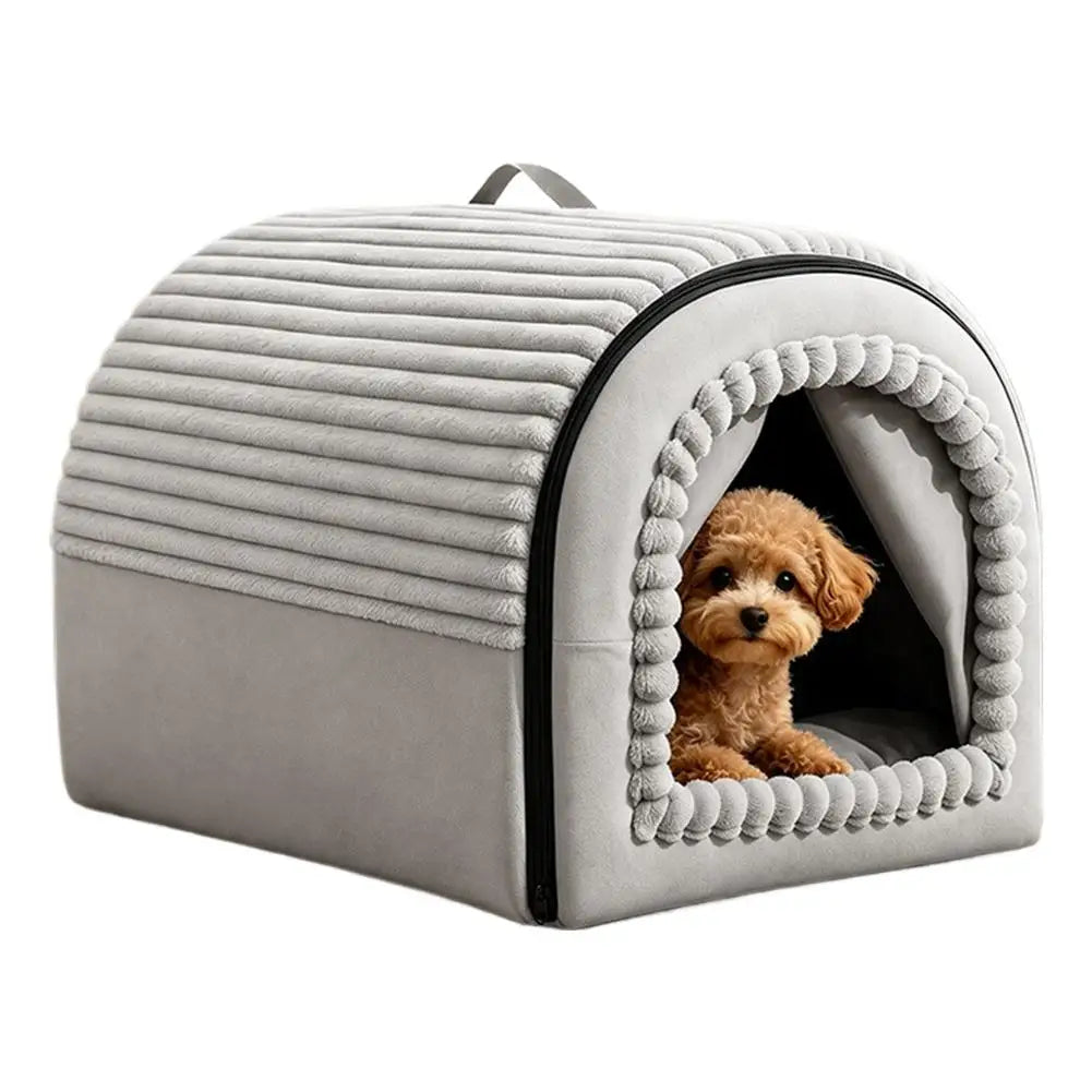 Gray plush pet bed cave with ribbed texture and pom-pom trim around the entrance made of washable warm cotton for comfort and durability.