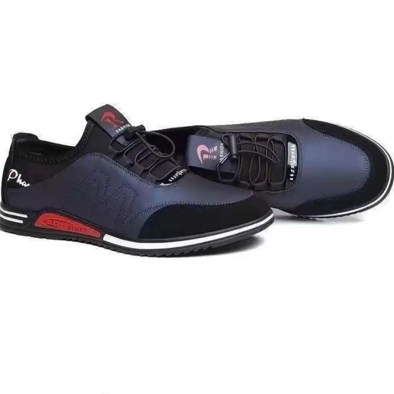 Men casual leather sneakers in black and navy blue with red accents on the sole featuring a lightweight non slip design and mesh and synthetic leather materials.