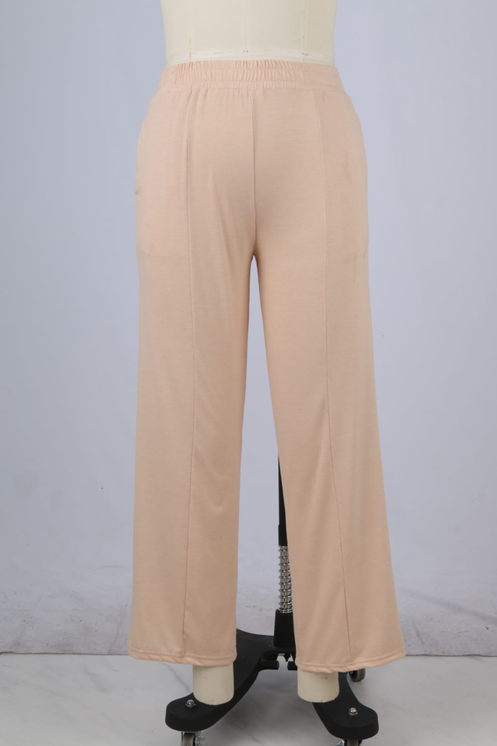 beige women’s wide leg fleece lined sweatpants featuring an elastic waistband and subtle side seams with a smooth pattern type