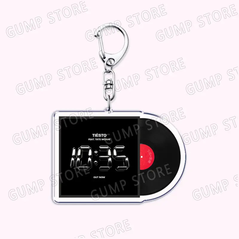 Silver acrylic keychain shaped like a vinyl record with a black and red design featuring the album cover for 10:35 by Tiesto, suitable as a Tate Mcrae acrylic keychain music fan gift.