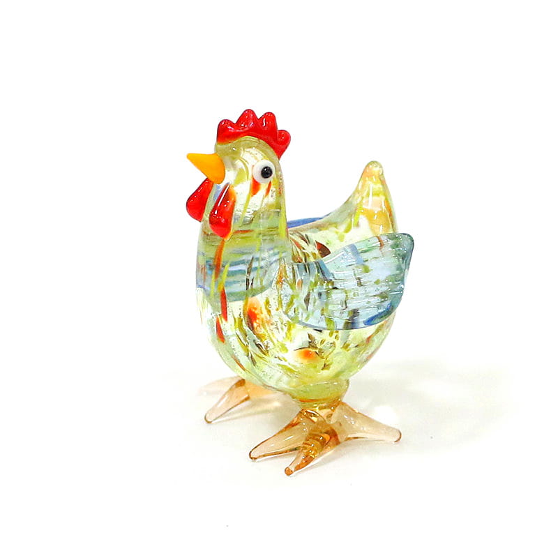 A translucent multicolored glass rooster miniature figurine with a red comb and wattle yellow beak black eye blue-tinted wings and amber feet designed as an Easter ornament.