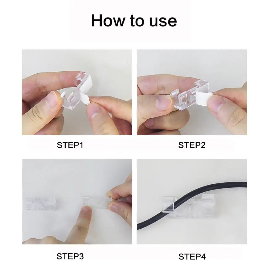 Clear plastic cable organizer clip with white adhesive strip for desktop cord management holder.