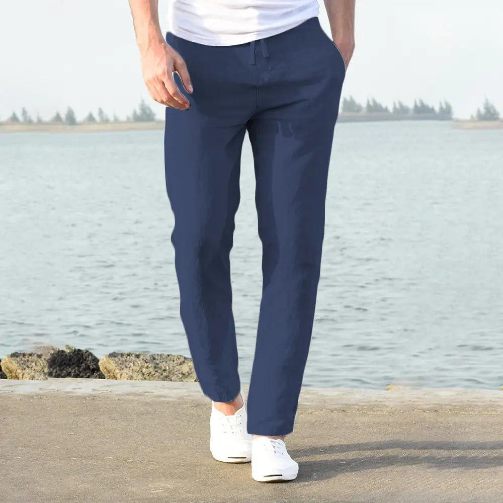 Navy blue slim-fit men cotton linen trousers breathable casual pants displayed from the back side.