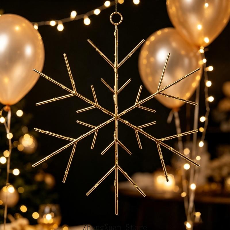 A delicate gold-toned metal snowflake Christmas tree and wreath ornament with a branching six-point design and hanging loop.