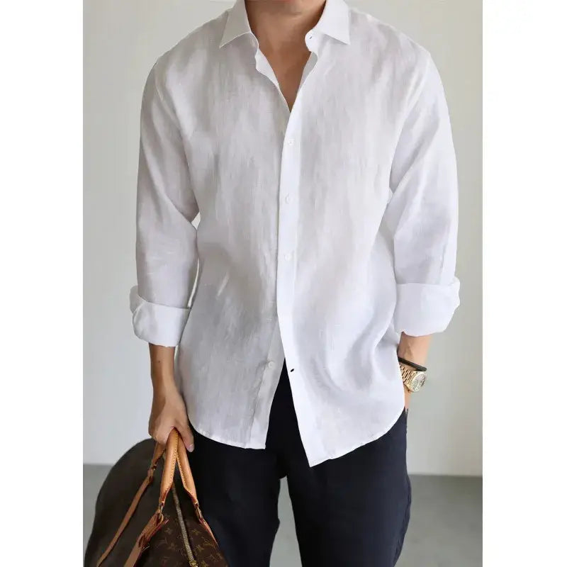 A crisp white men cotton linen casual button down shirt with rolled up sleeves.
