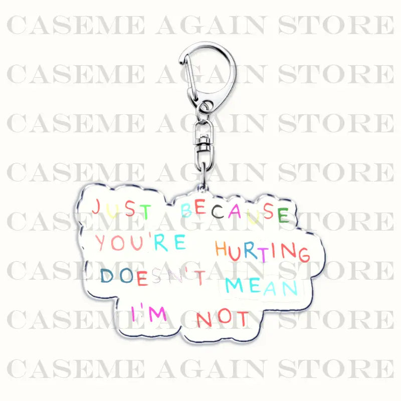 A silver cloud-shaped acrylic keychain with colorful hand-painted text reading just because you’re hurting doesn’t mean i’m not from the Gracie Abrams anime fan gift collection.