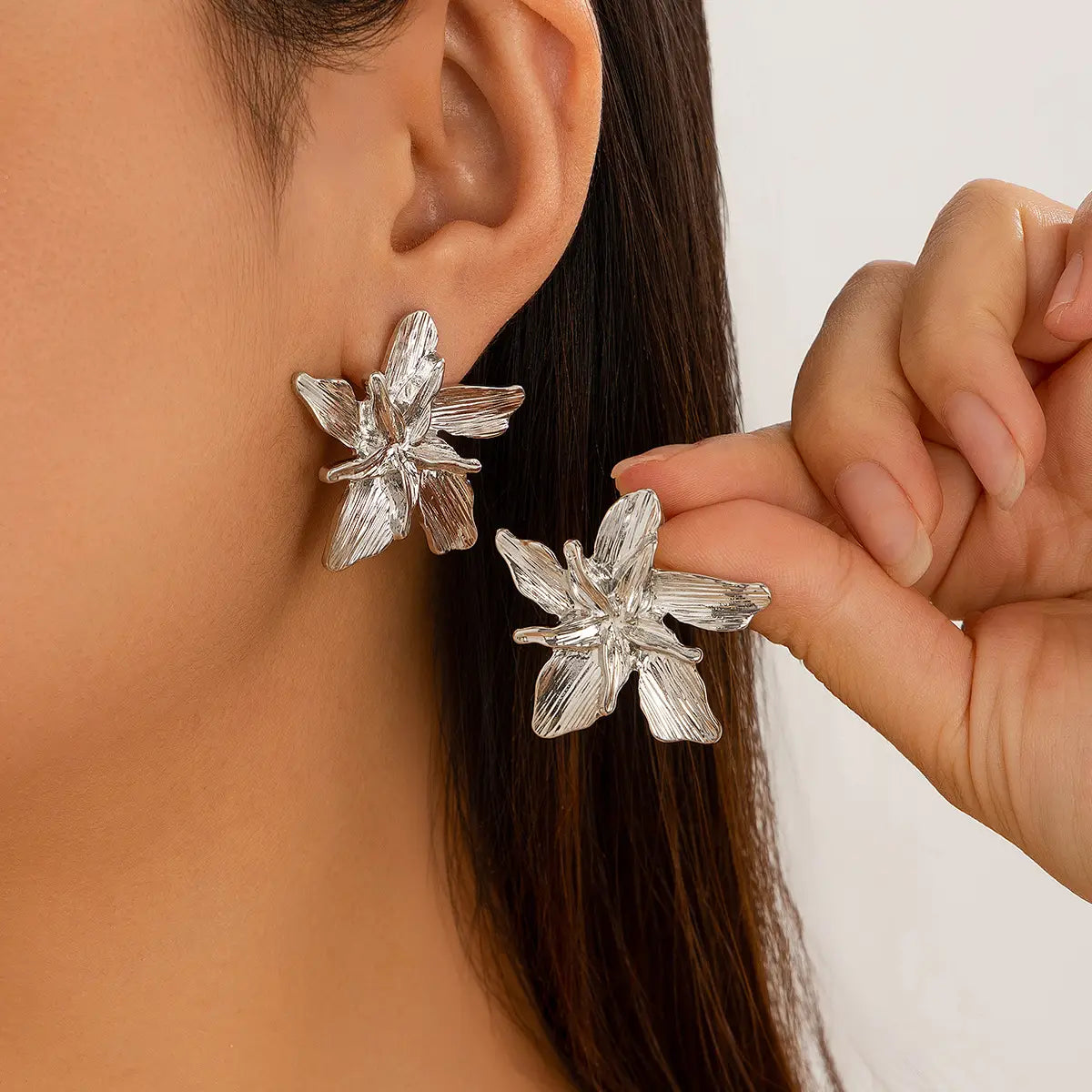 silver adjustable double layer flower ring with intricately textured flower-shaped design showcasing delicate and elegant craftsmanship