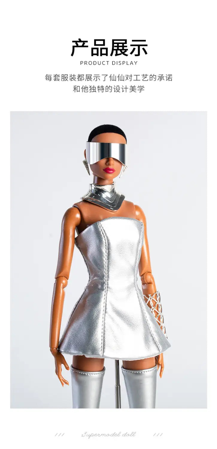 A futuristic retro doll outfit featuring a silver metallic dress with a structured bodice and flared skirt paired with matching thigh-high boots for 30cm 1/6 models.