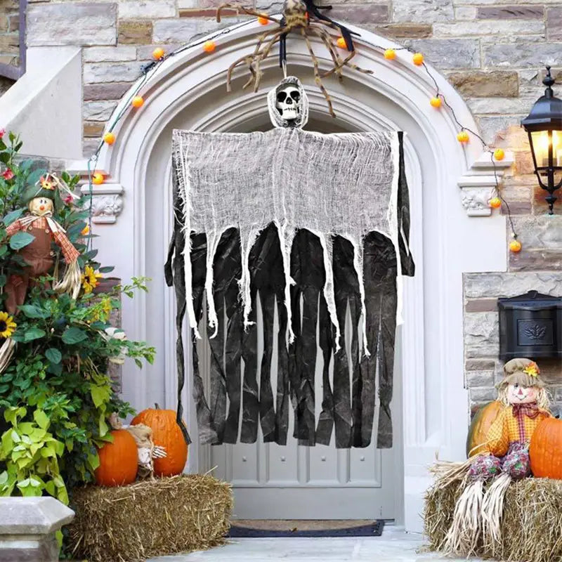 Black and white hanging ghost Halloween decoration with a skull head made of fabric and mesh material suitable for remote area outdoor use.