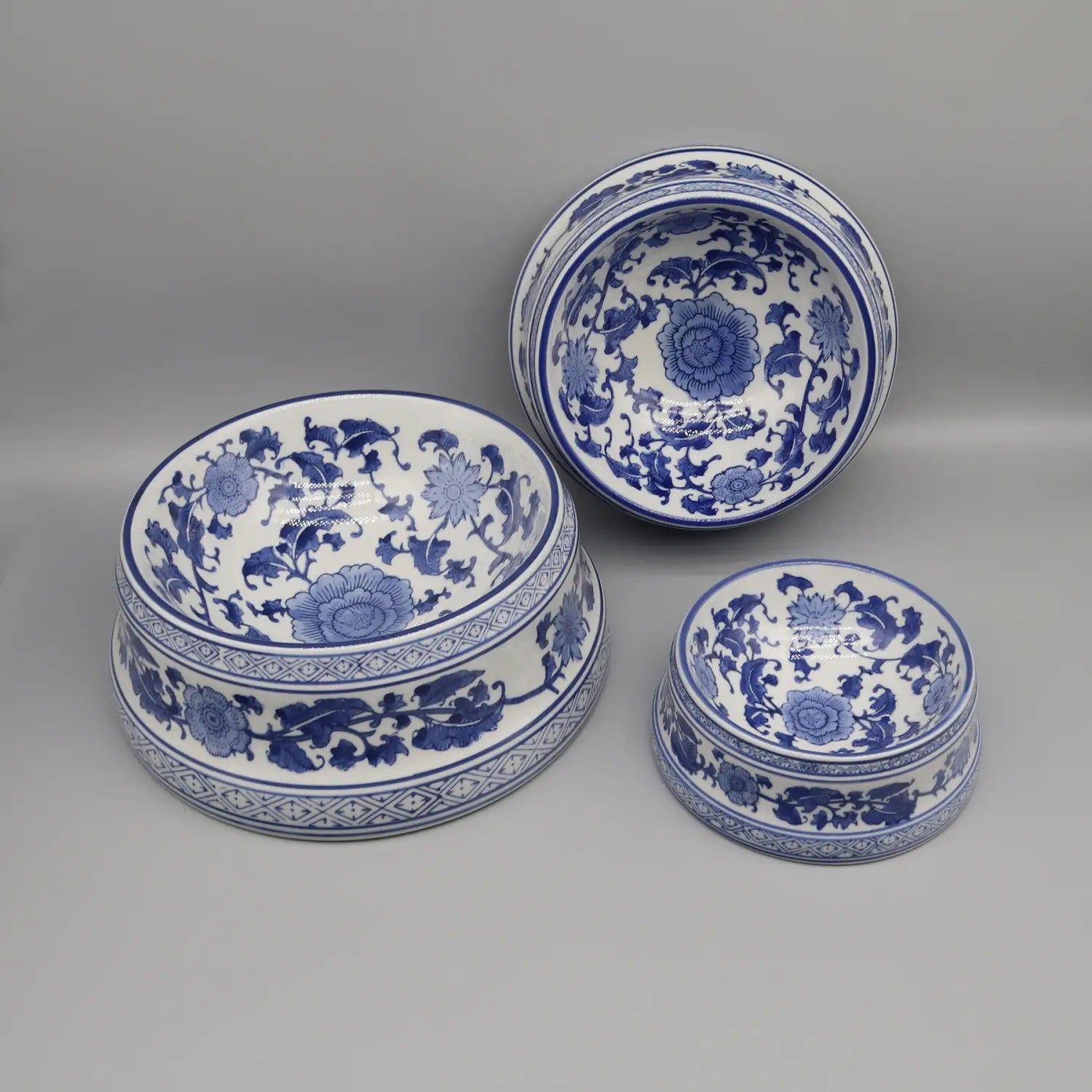 three blue and white porcelain feeding bowls with intricate floral patterns in a ceramic blue floral porcelain set