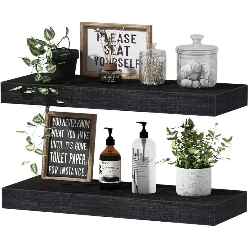 black floating shelves with a matte wood finish designed for living room wall display