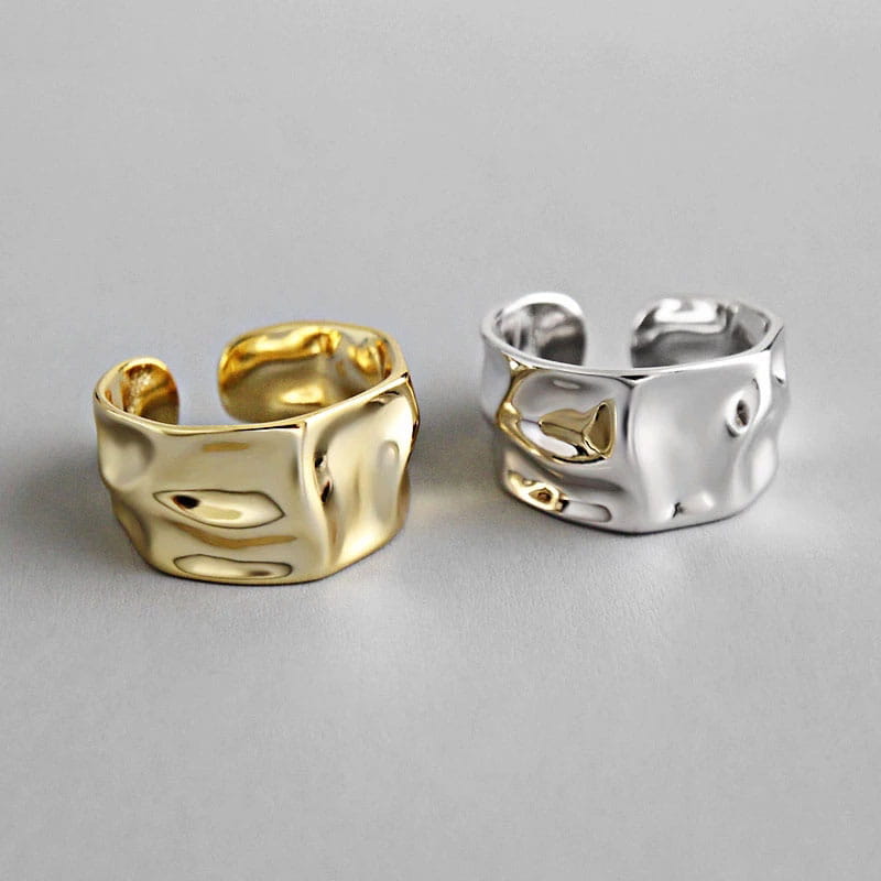 Sterling silver open ring for women featuring gold and silver textured bands with a hammered irregular surface finish.