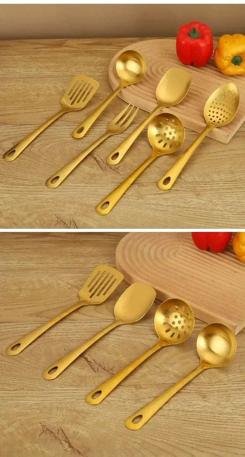 Set of five gold kitchen utensils made of stainless steel with sleek polished handles and various functional designs including slotted solid and perforated surfaces for cooking use.