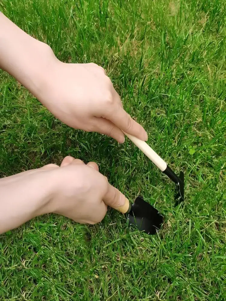 black metal garden shovel with a light-colored wooden handle from a small gardening tools set metal wood designed for small gardening tasks