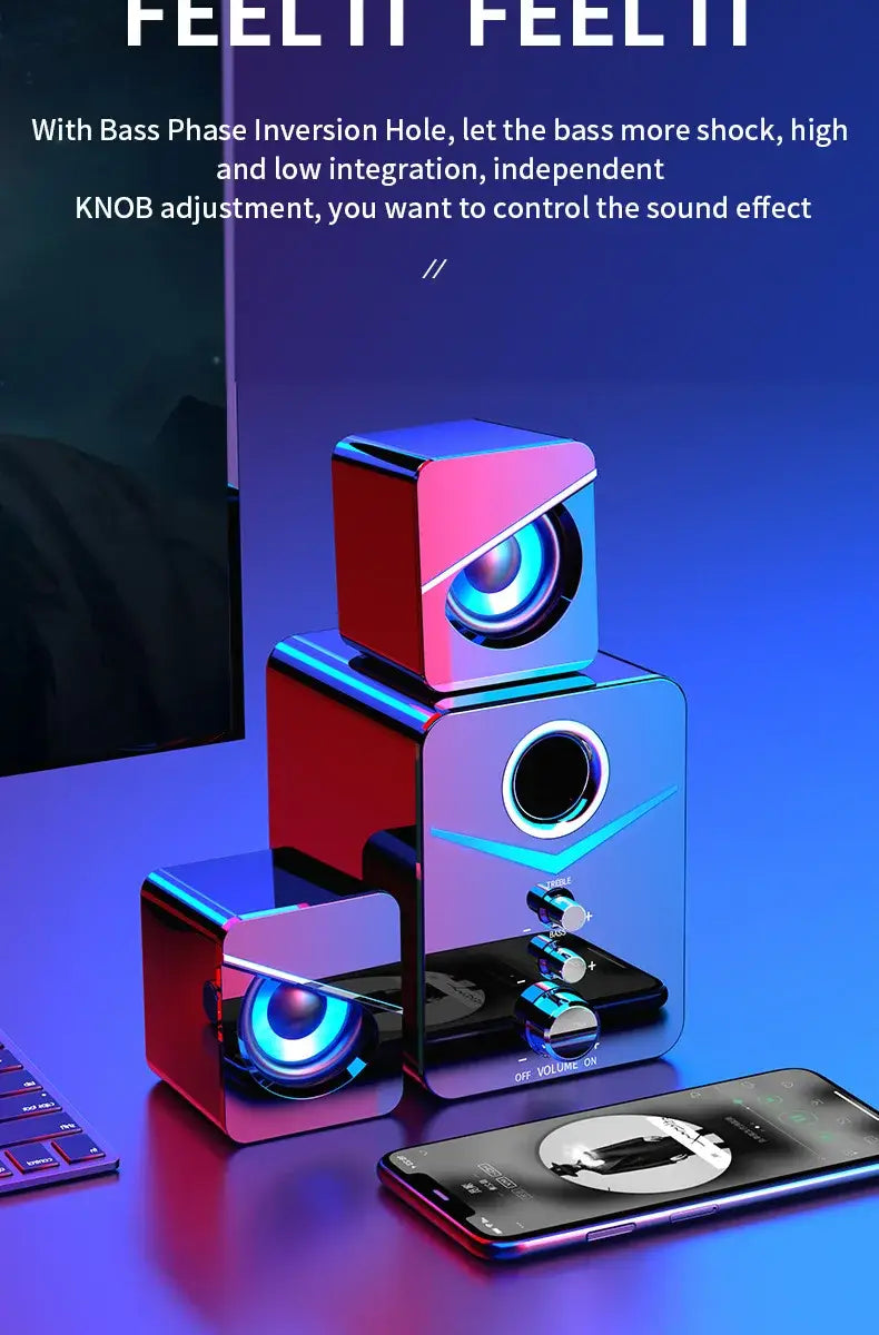 Ensemble de trois enceintes de jeu Bluetooth en forme de cube avec des finitions métalliques rouge et bleues vibrantes, des haut-parleurs circulaires à DEL lumineux et des boutons réglables pour le contrôle du son, conçu comme un système de caisson de basses.