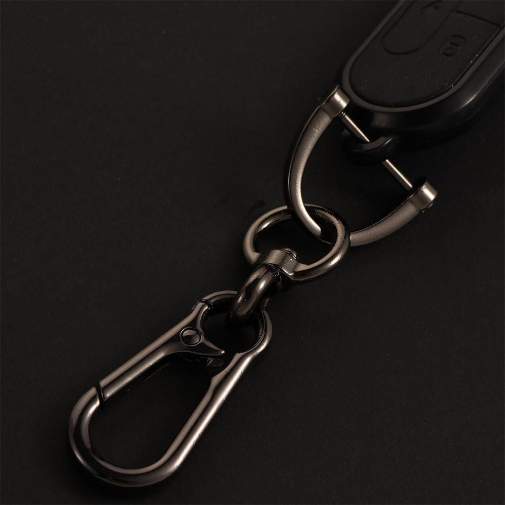 Black metal car key clip carabiner keychain with a sturdy carabiner clip, polished metallic rings, and a car remote attached.