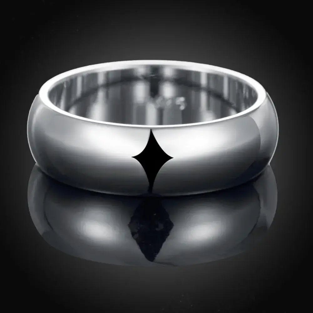 A high quality sterling silver ring featuring a sleek polished band with a bold black starburst engraving in sizes 5 to 11.