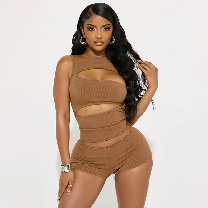 Tan ribbed knit two-piece set consisting of a tank top and shorts with cut-out details.