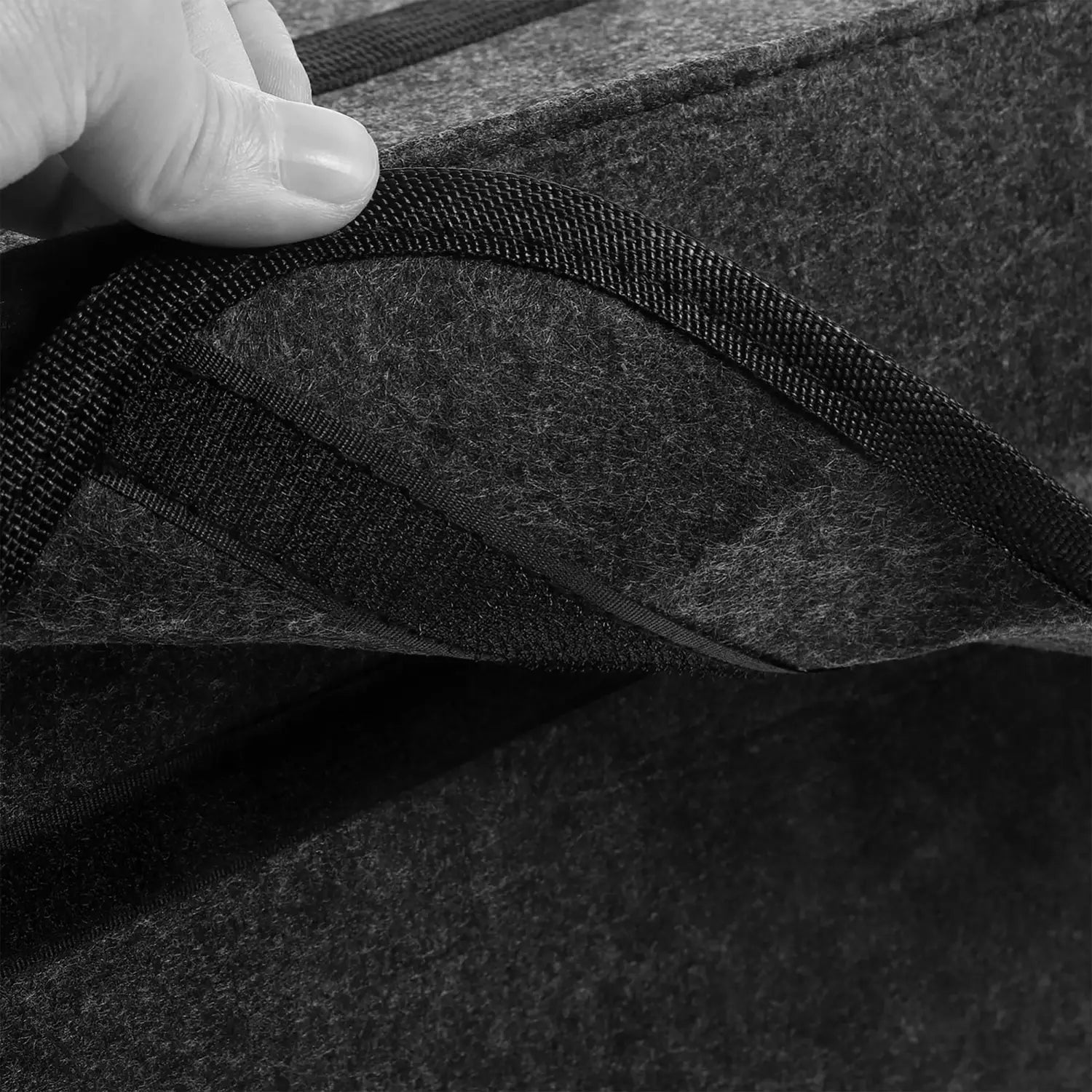 dark gray woolen felt car trunk organizer storage bag with black woven trim shown from a top angle