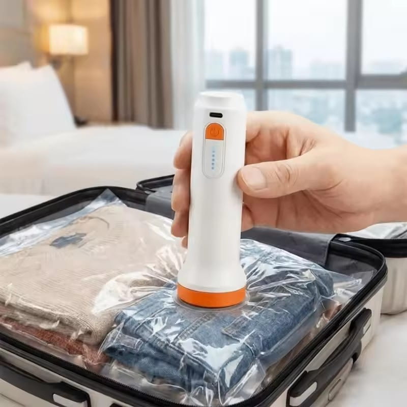 white and orange handheld air pump with circular base for vacuum storage bags used to compress clothes in clear plastic bags for 17l vacuum storage