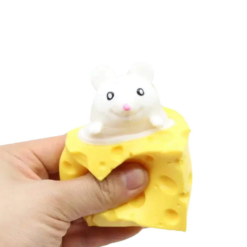 A white plush cheese mouse with black eyes and pink nose sits on a yellow squeeze cheese toy shaped like cheese