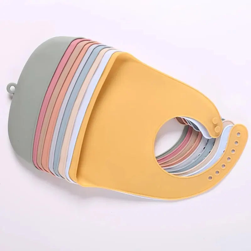 The baby feeding bib is made of silicone and has a water-resistant design. It is suitable for feeding purposes.