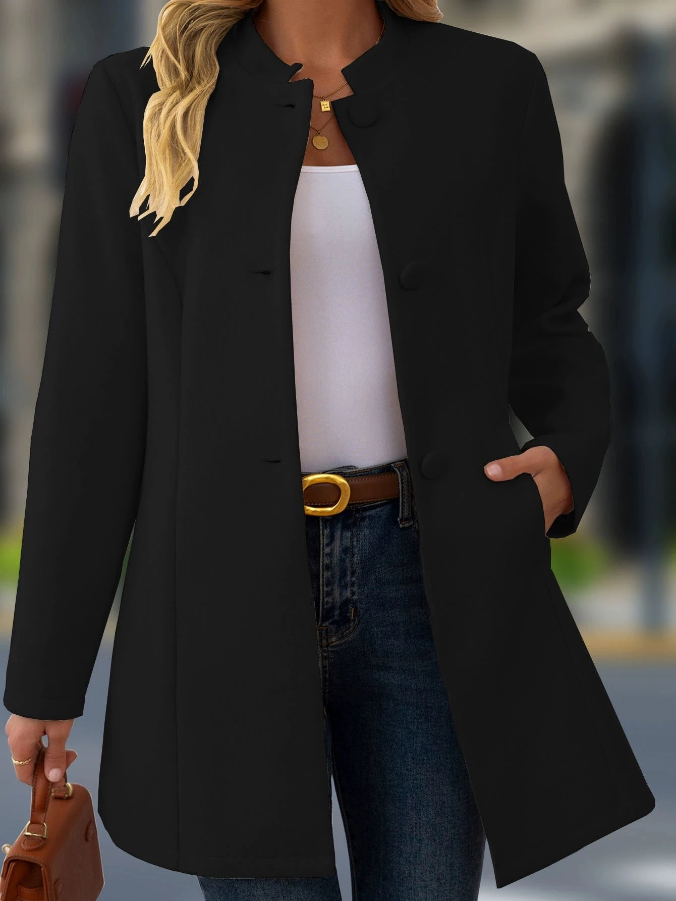 Black sleek longline wool blend coat with mandarin collar and front button closure ideal for outerwear.