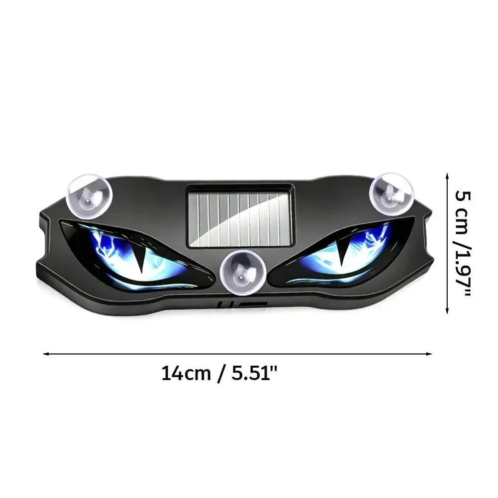 lampe d’avertissement solaire noire en plastique avec motif d’œil de démon, yeux à DEL bleues, panneau solaire central et trois ventouses pour le montage sur le tableau de bord de la voiture